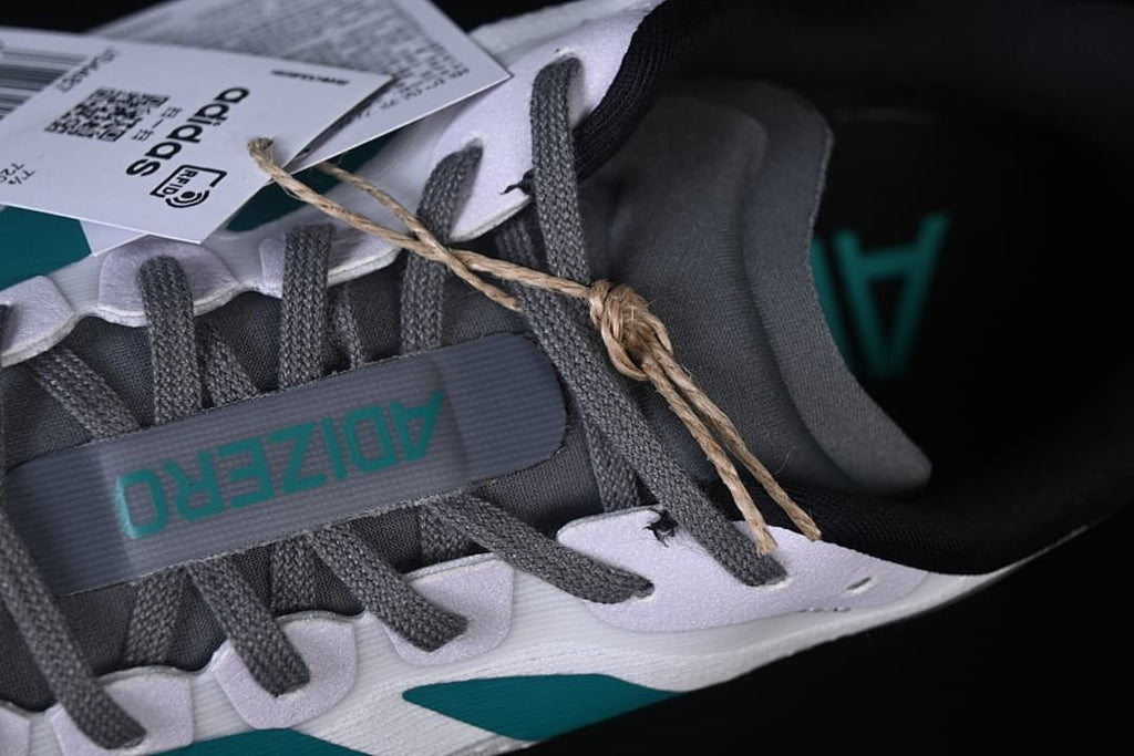 Close-up of the gray laces and tongue branding.