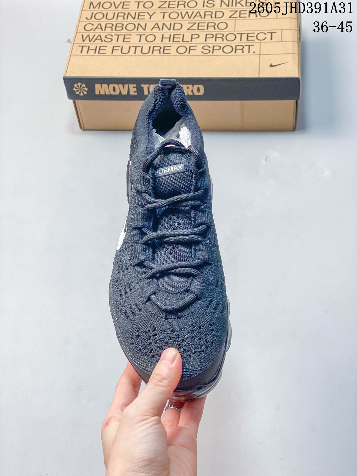 Front view of the knit upper and laces on a dark blue Nike Air VaporMax shoe