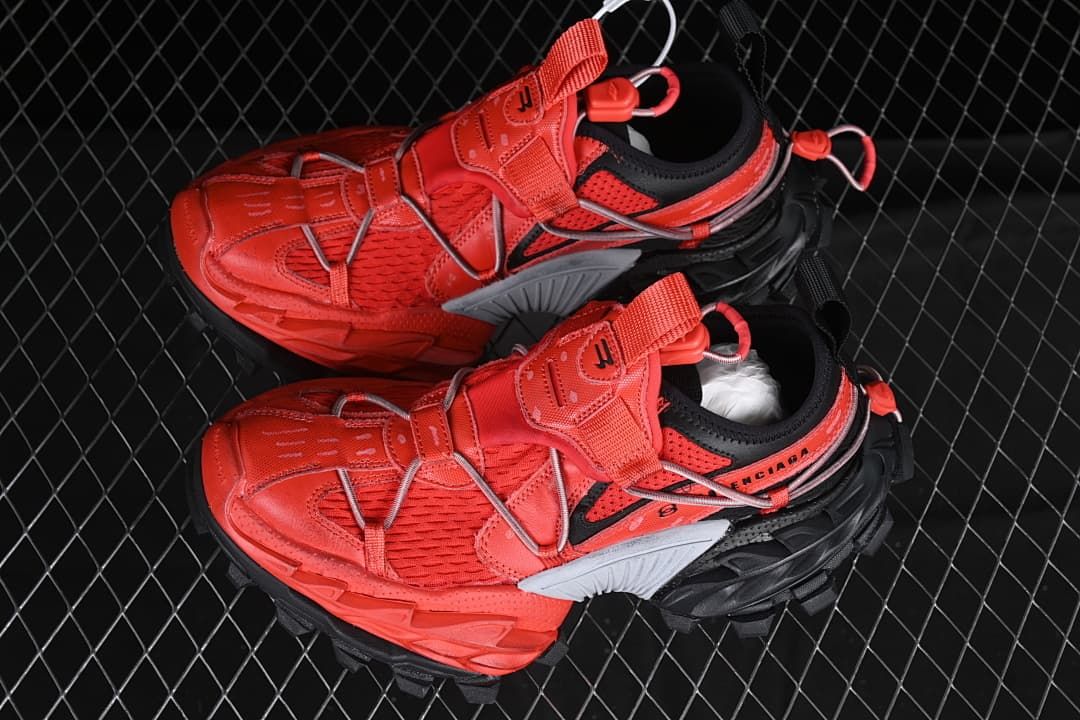 Pair of red and black Hike Trail sneakers shown from above