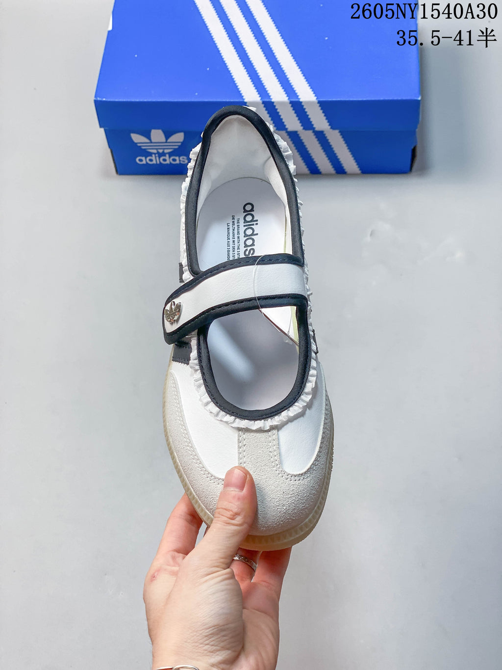 Top view showing the strap closure and ruffle trim on a Samba Jane sneaker