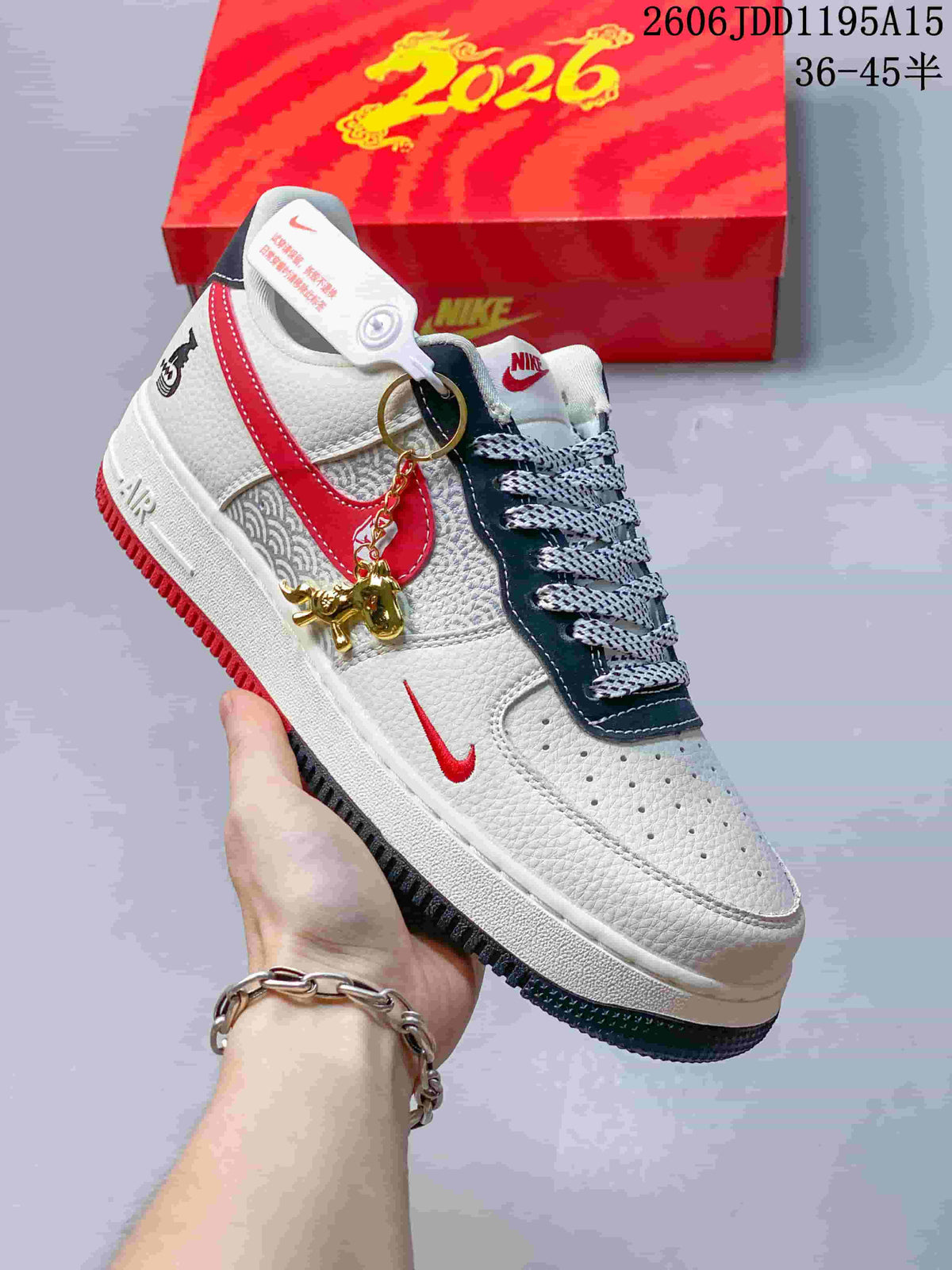 Close view of the white and red Air Force 1 Low with a horse-themed charm and patterned side panel