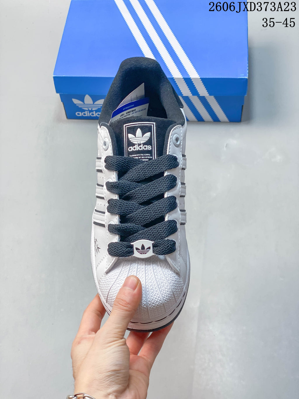 Front view highlighting the shell-toe design and dark laces