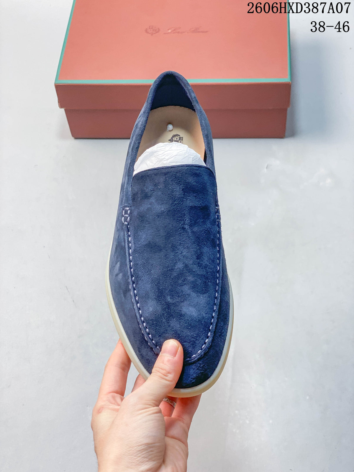 Top view of a blue loafer showing its stitched apron toe.