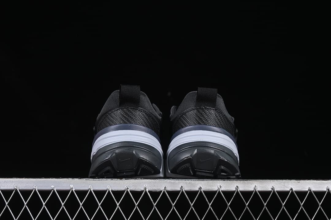 Rear view of both shoes showing their heels and soles