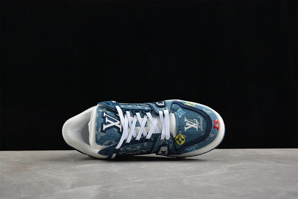 Top-down view of a blue patterned sneaker with white laces.