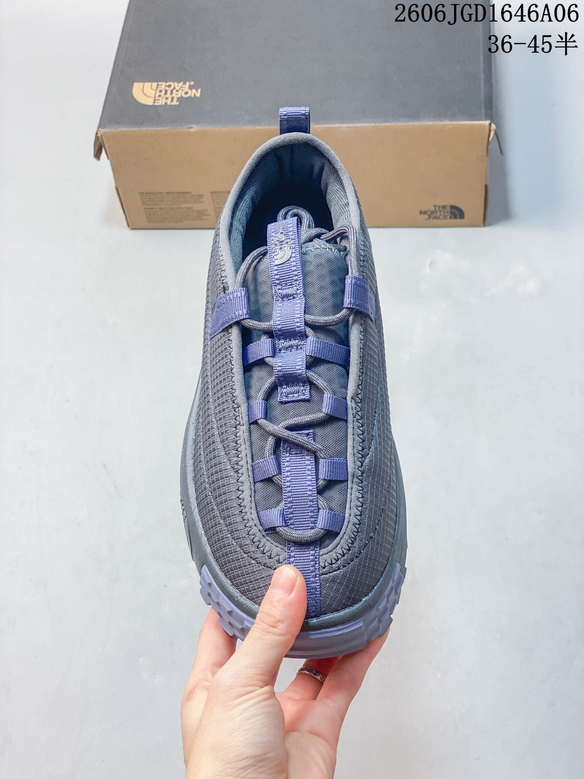 Top view of the gray mule shoe showing its lace-and-webbing detail