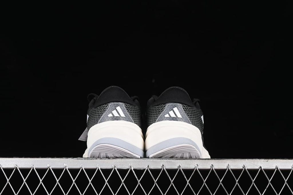 Rear view of both shoes showing heel panels and outsoles.
