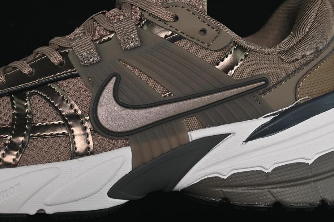 Close-up of the side Swoosh, overlays, and sculpted midsole