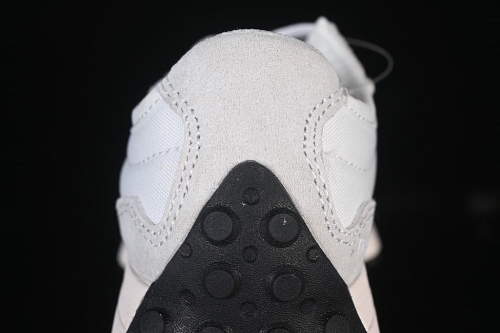 Rear close-up of the sneaker showing the gray heel overlay and dark outsole.
