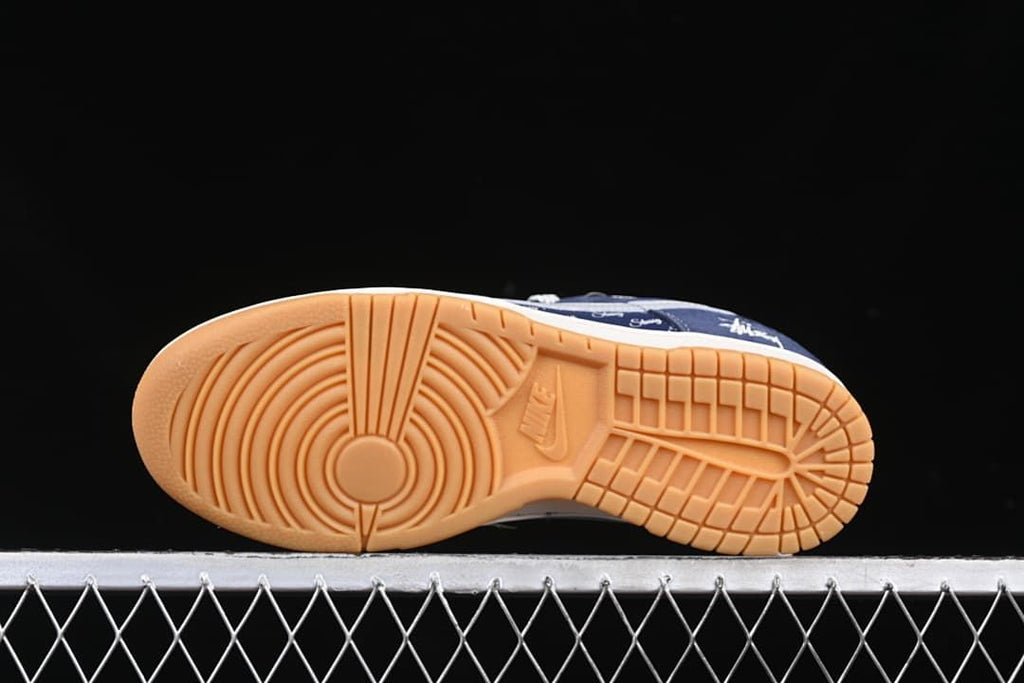 Underside of the sneaker showing gum-colored tread