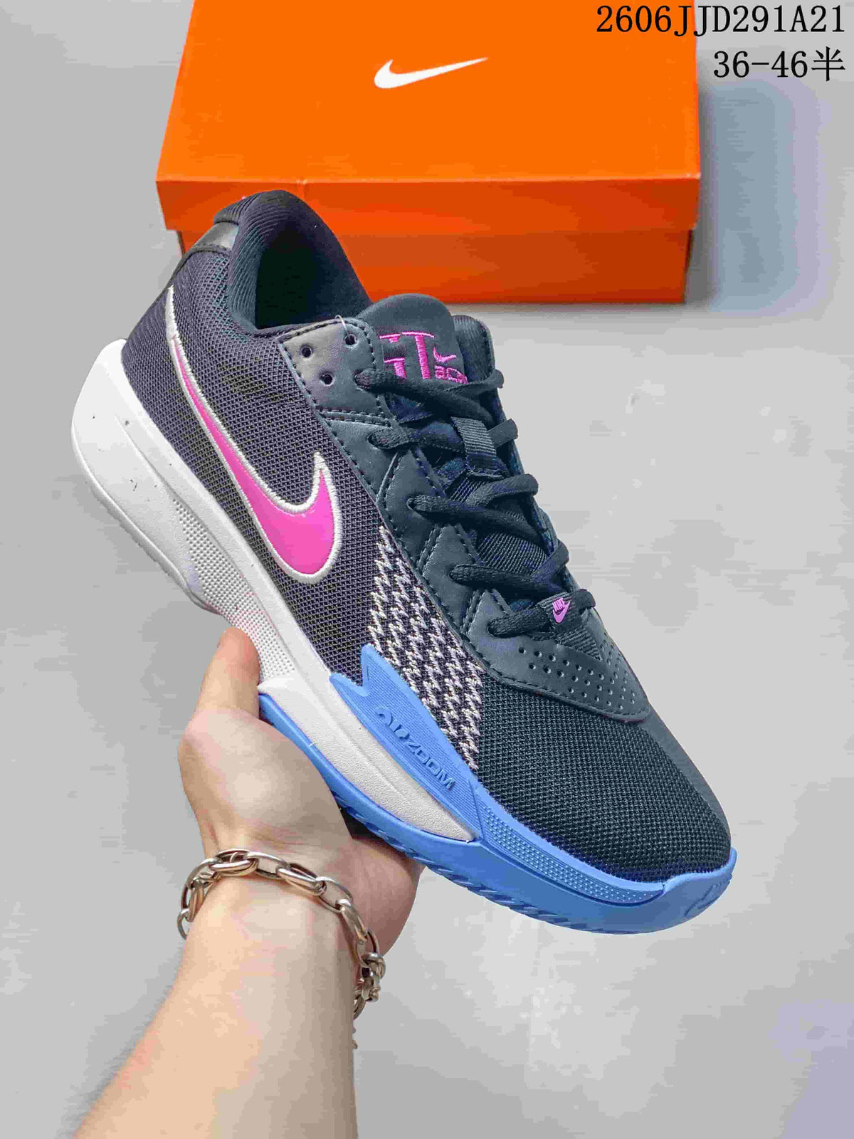 Charcoal Nike G.T. Cut 3 basketball shoe with a pink Swoosh and blue outsole accents.