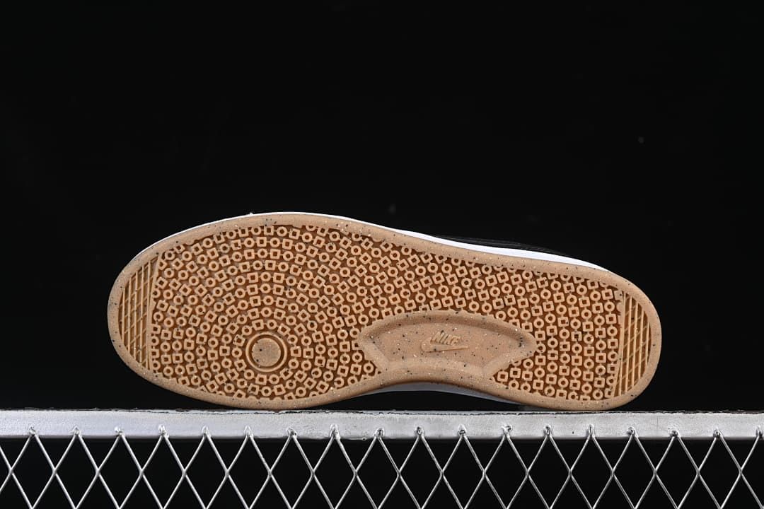 Underside view showing the gum-colored patterned outsoles.