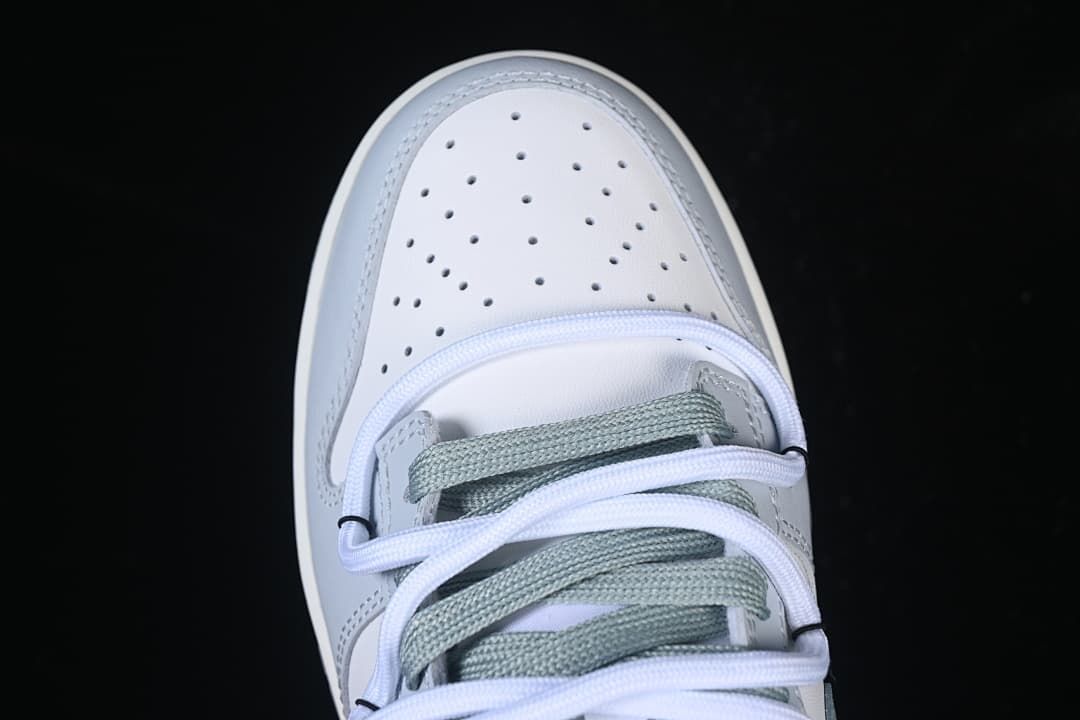 Top-down view of perforated toe and lacing