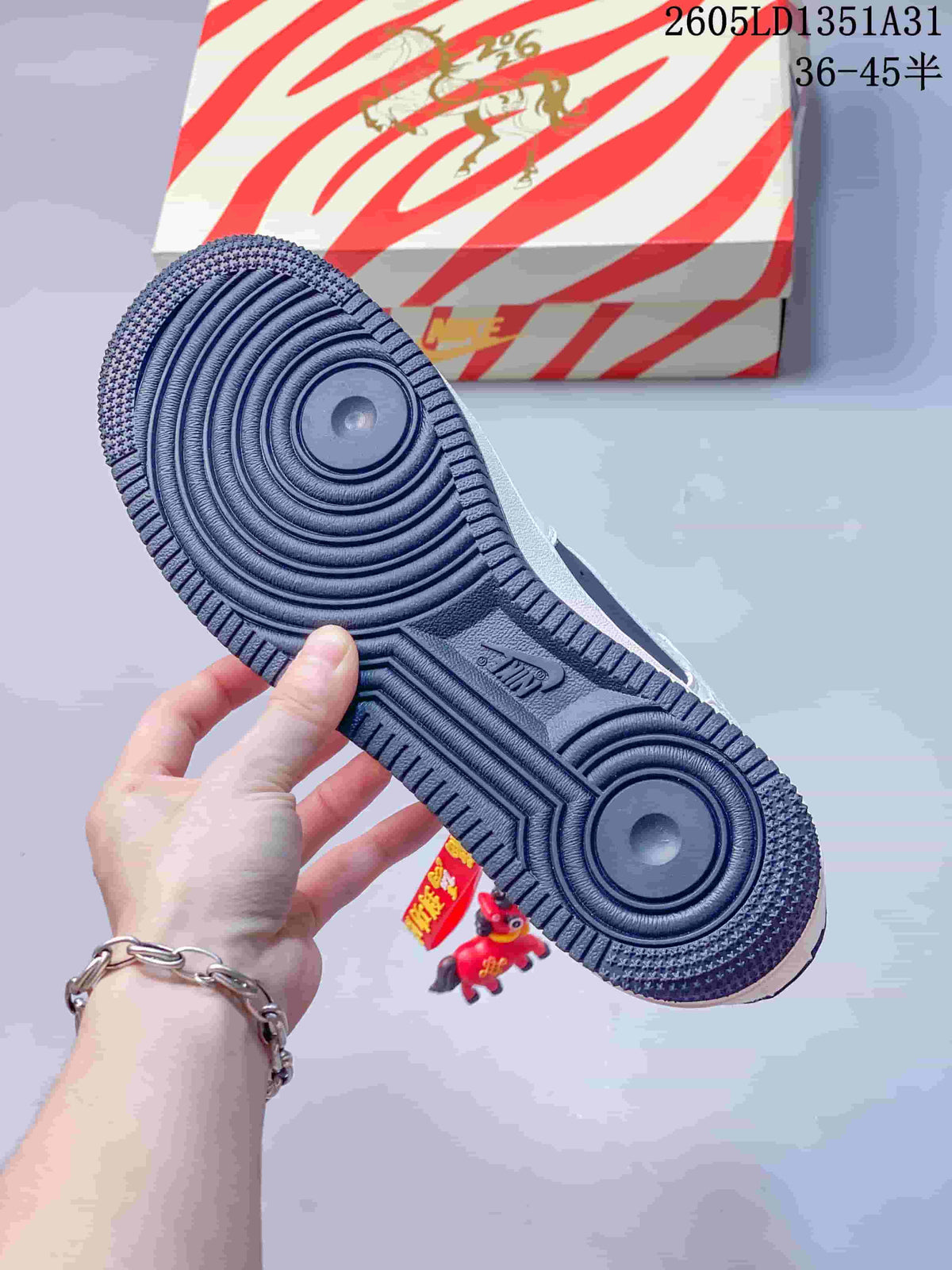 Close-up of the dark navy patterned outsole