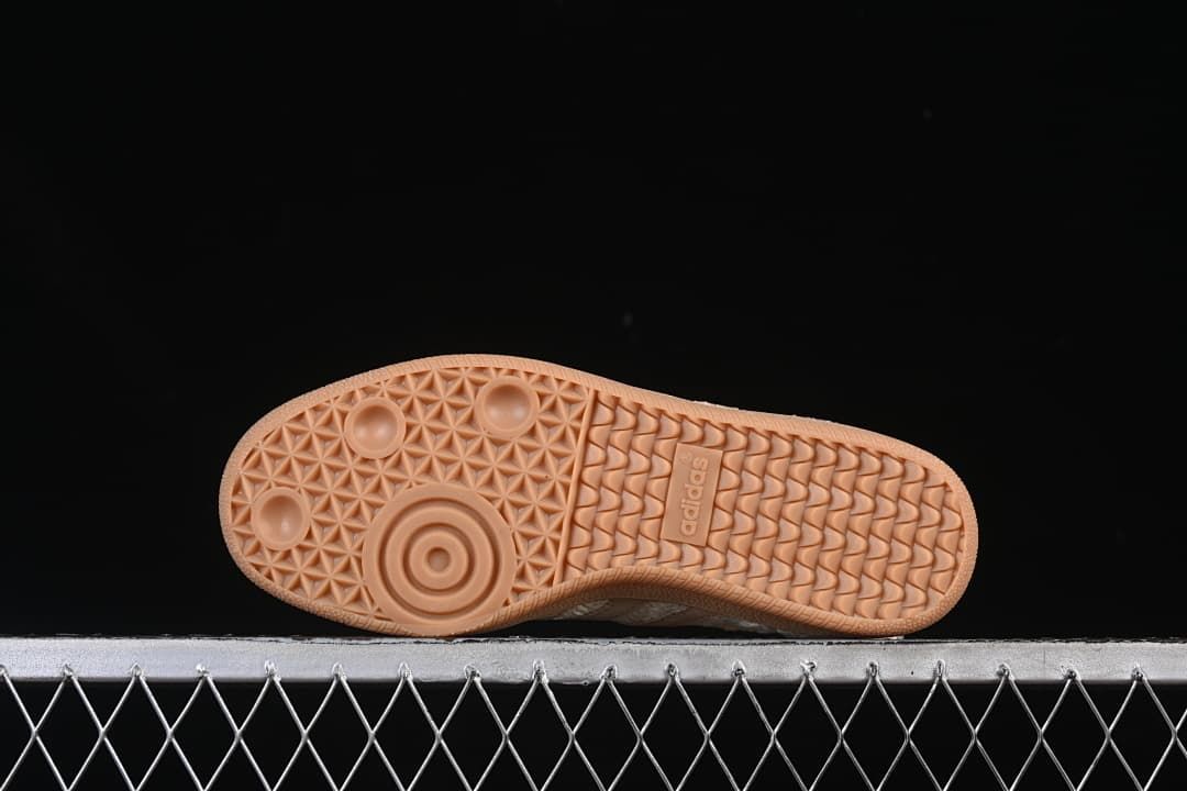 Underside view of the gum-colored outsole with patterned tread