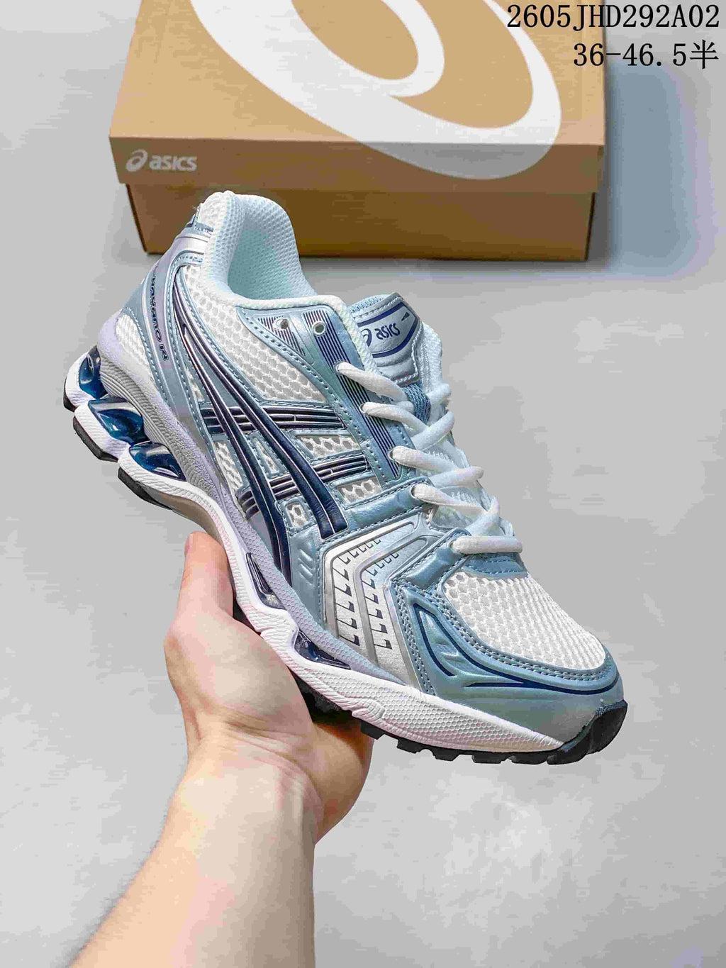 ASICS GEL-KAYANO 14 sneaker in white and silver with blue detailing