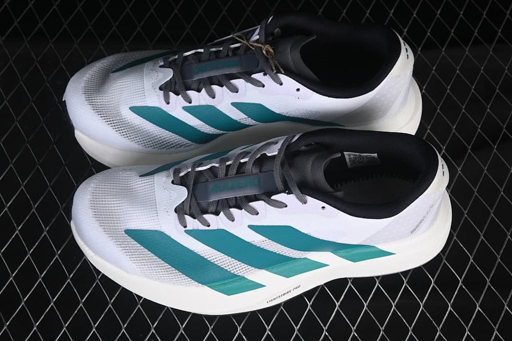 Pair of white and teal adidas Adizero Evo SL running shoes viewed from above.
