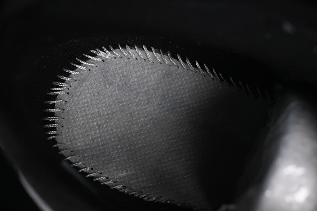 Close-up view inside the sneaker showing a grey panel and stitching.