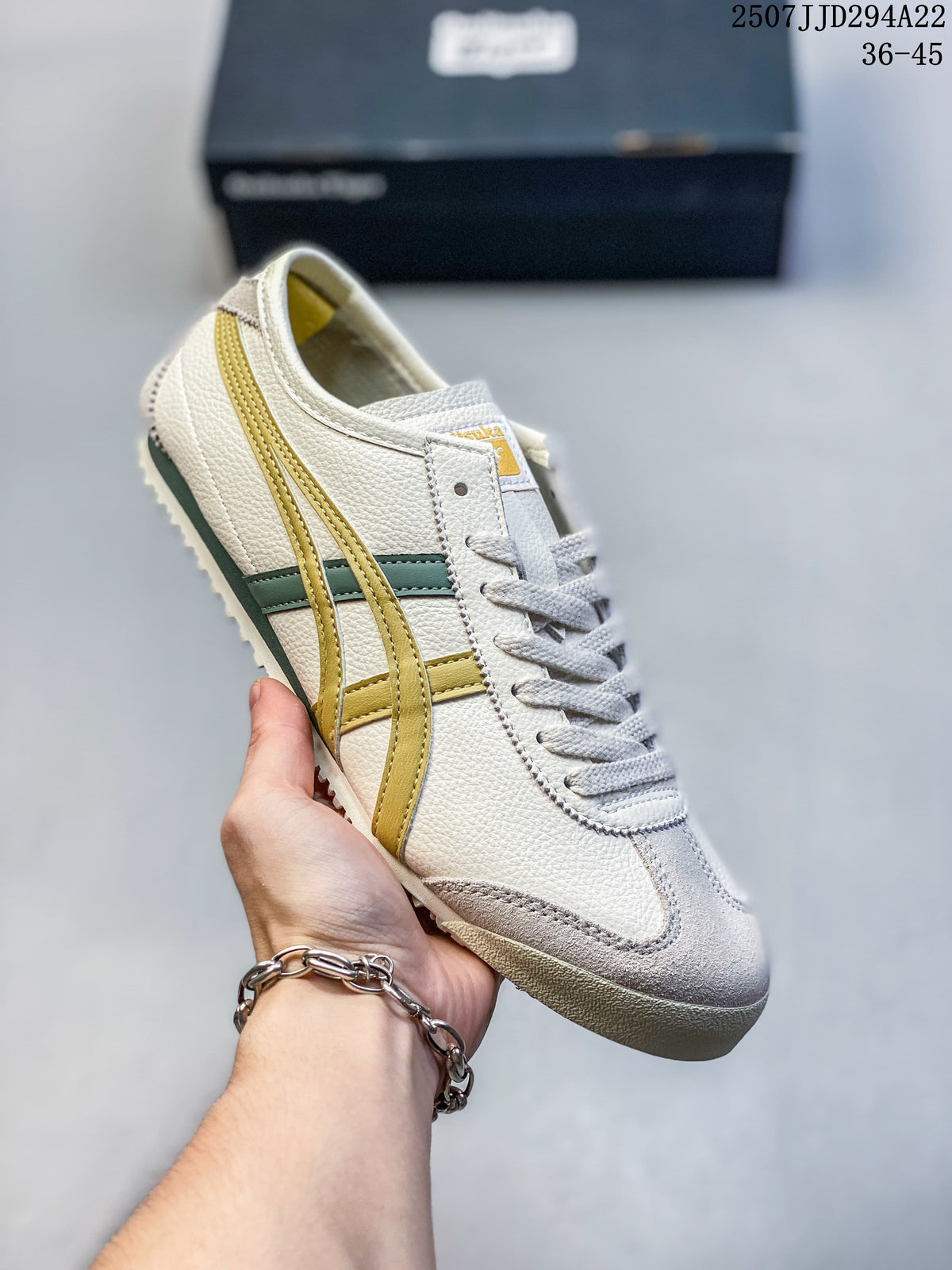 Close-up of a cream Mexico 66 Deluxe sneaker with mustard and green side stripes
