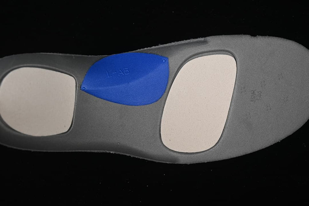 Close-up of the sneaker insole underside showing colored cushioning panels