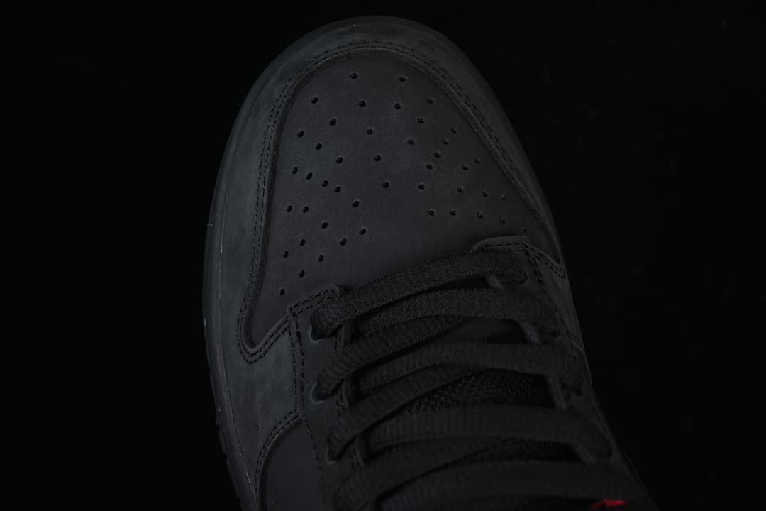 Top-down detail of the perforated black toe and laces
