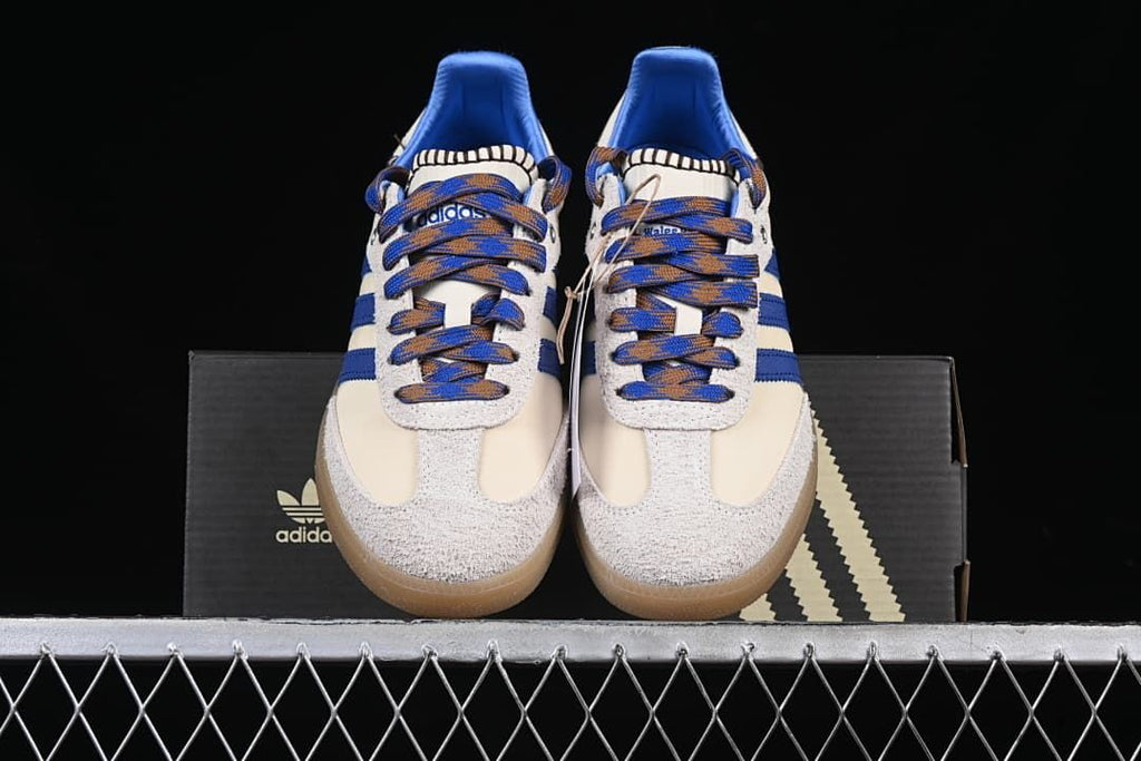 Front view of the pair with textured toe overlays, blue stripes and gum-colored soles.