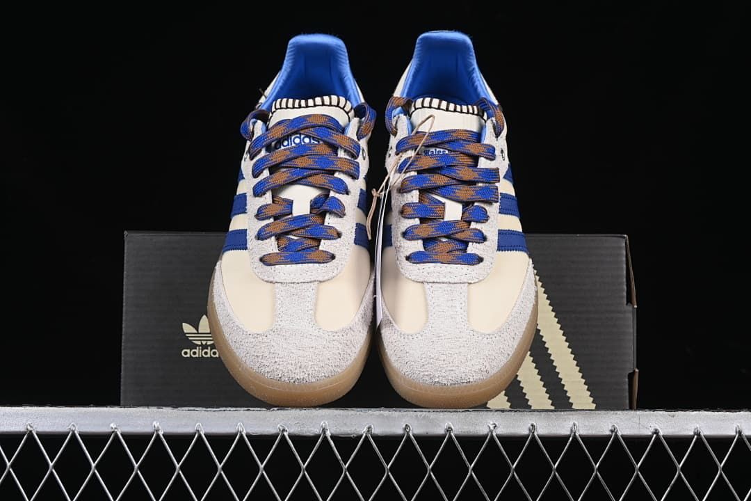 Front view of the pair with textured toe overlays, blue stripes and gum-colored soles.