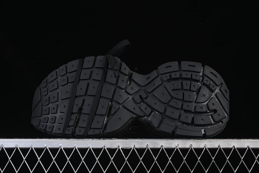 Underside view showing the segmented tread pattern.