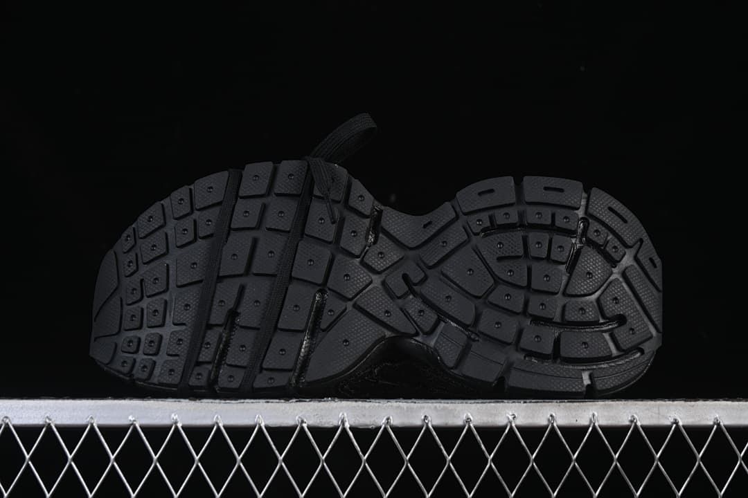 Underside view showing the segmented tread pattern.