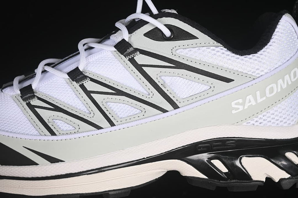 Close-up of the shoe side with mesh panels, overlay, and lace supports.