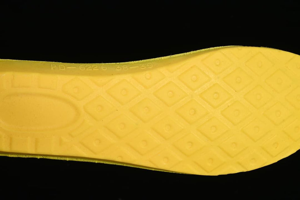 Close-up of the yellow outsole tread