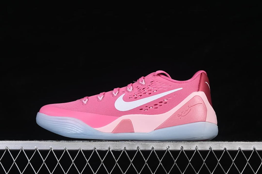 Side view of the pink Kobe 9 Stitches Low basketball shoe