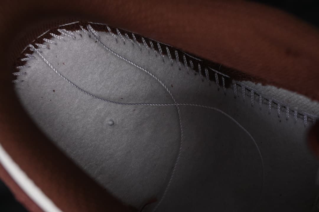 Close-up inside the sneaker showing interior stitching