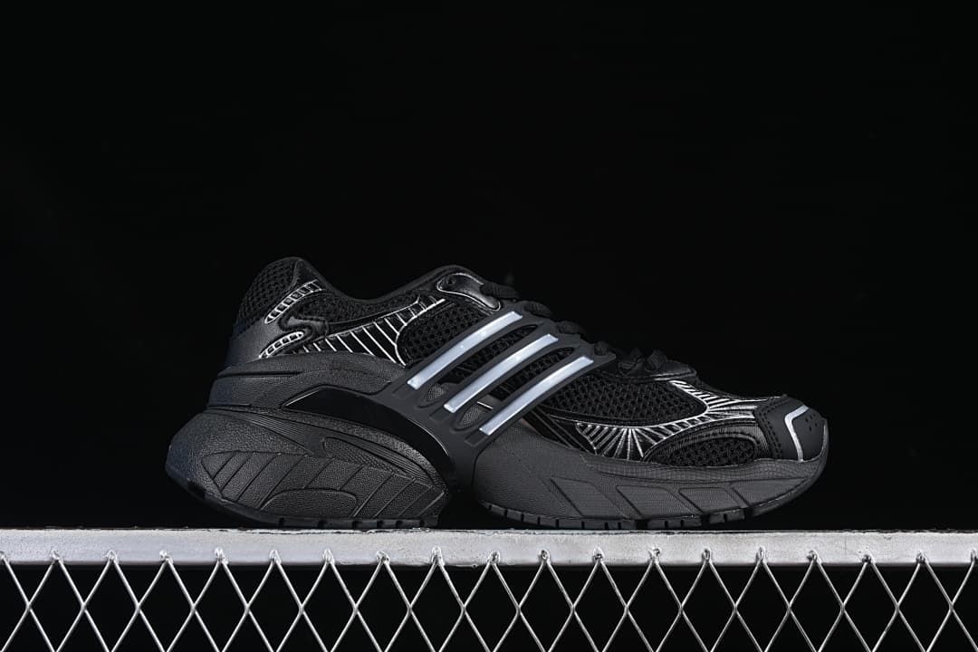 Side profile highlighting the black upper and silver-toned stripes