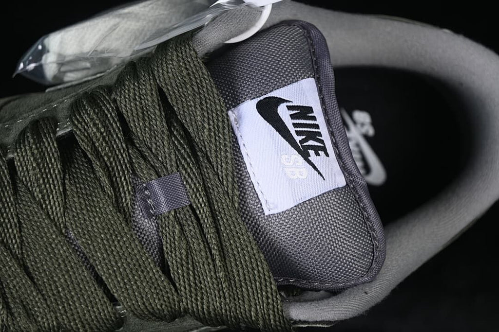 Close-up of the tongue label and olive-green laces