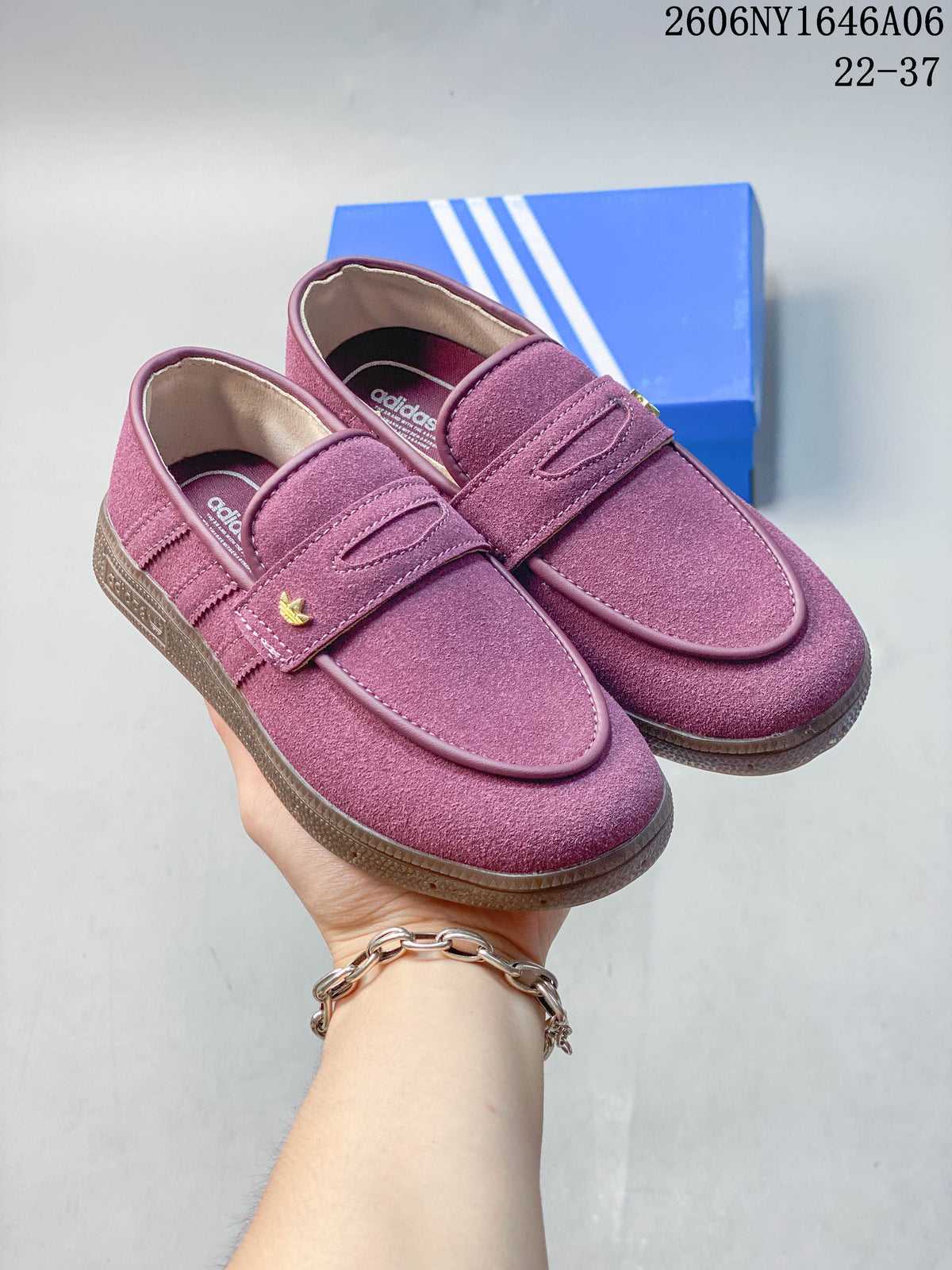 Pair of mauve Adidas Handball Spezial sneakers with strap detail and brown-toned soles