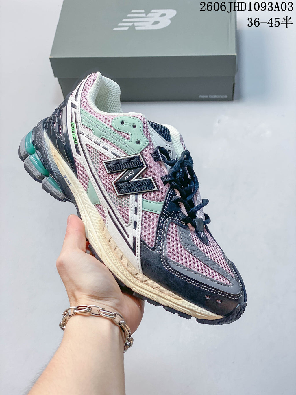 Pink, mint, navy and gray New Balance 1906U sneaker