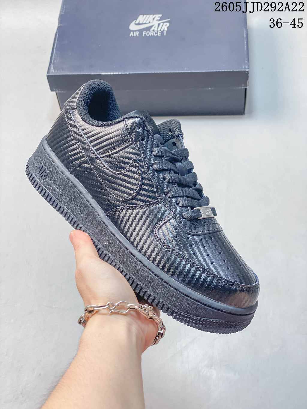 Dark patterned low-top sneaker with layered side panels