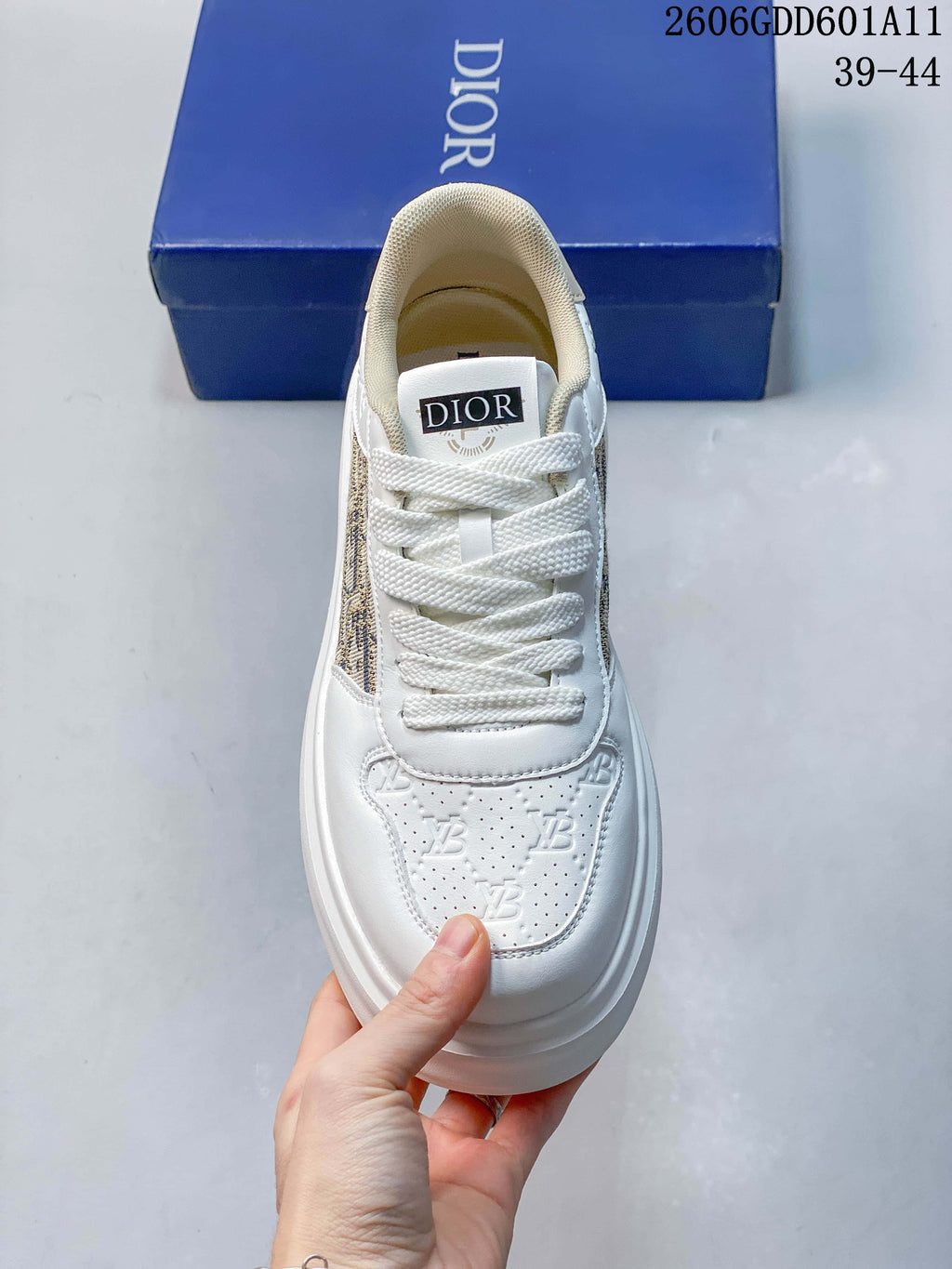 Top view of the sneaker showing white laces and a perforated toe panel.