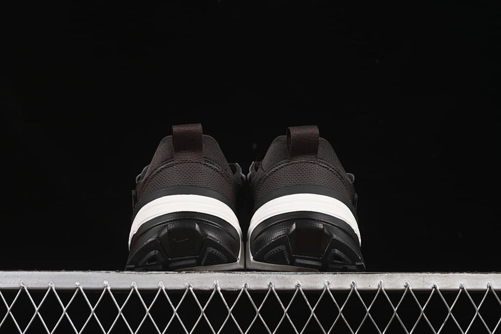 Rear view of the pair showing heel pull tabs and layered soles
