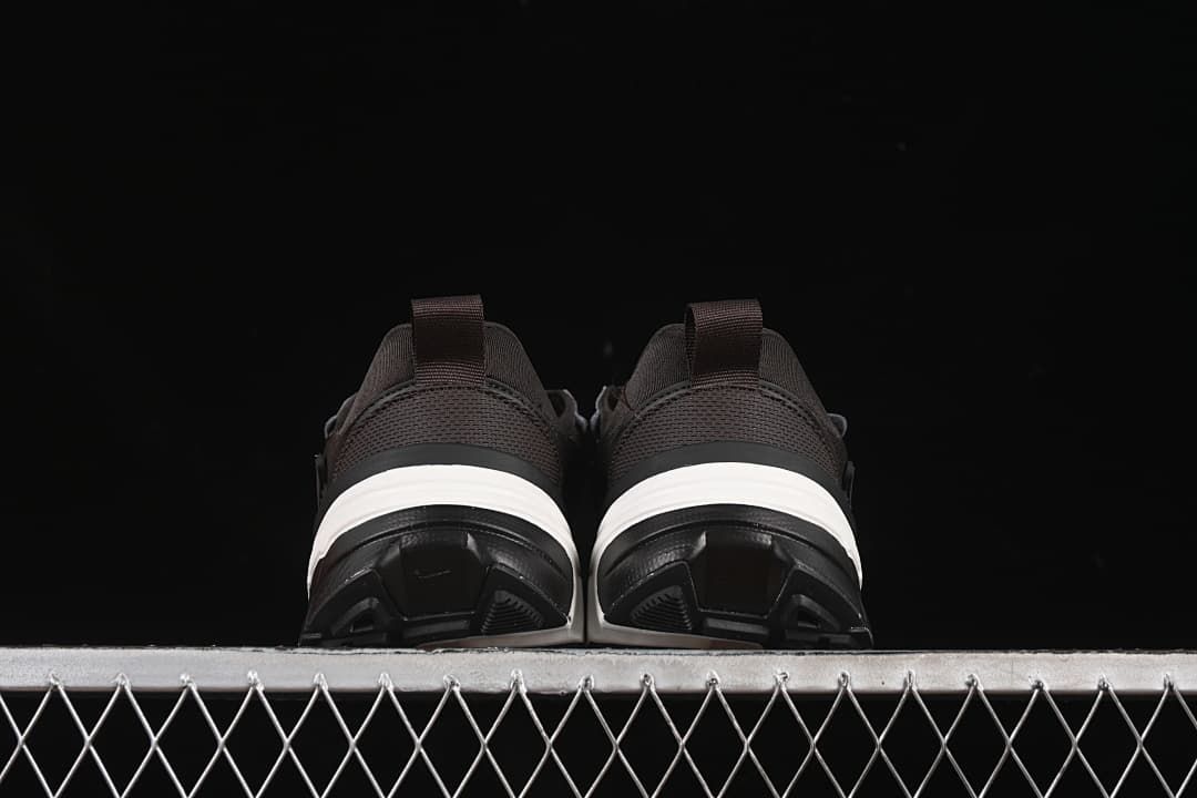 Rear view of the pair showing heel pull tabs and layered soles