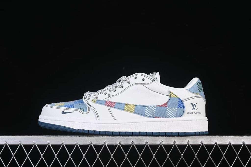 Side view of a white low-top sneaker with blue multicolor patterned panels and a patterned Swoosh.