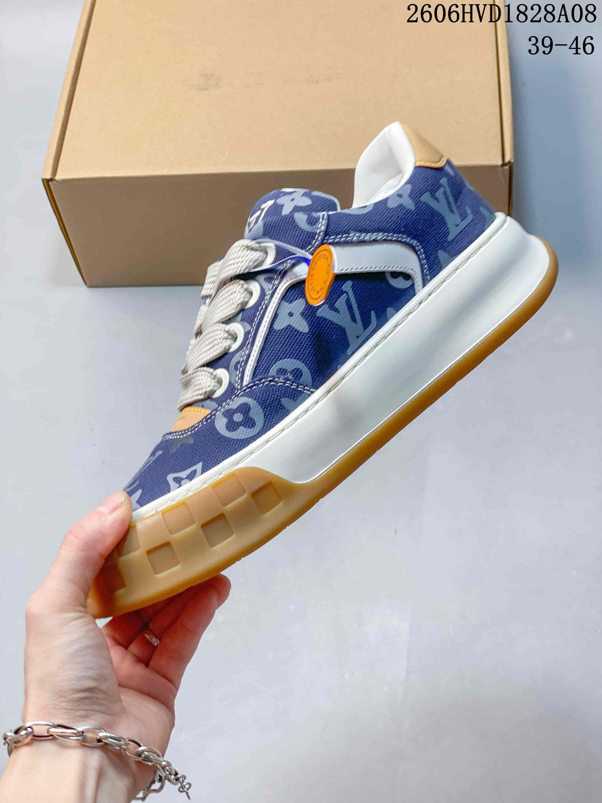Side view of the blue patterned sneaker with white midsole and gum-colored outsole