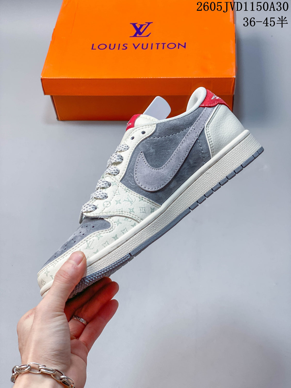 Side profile of a grey and off-white low-top sneaker with patterned overlays