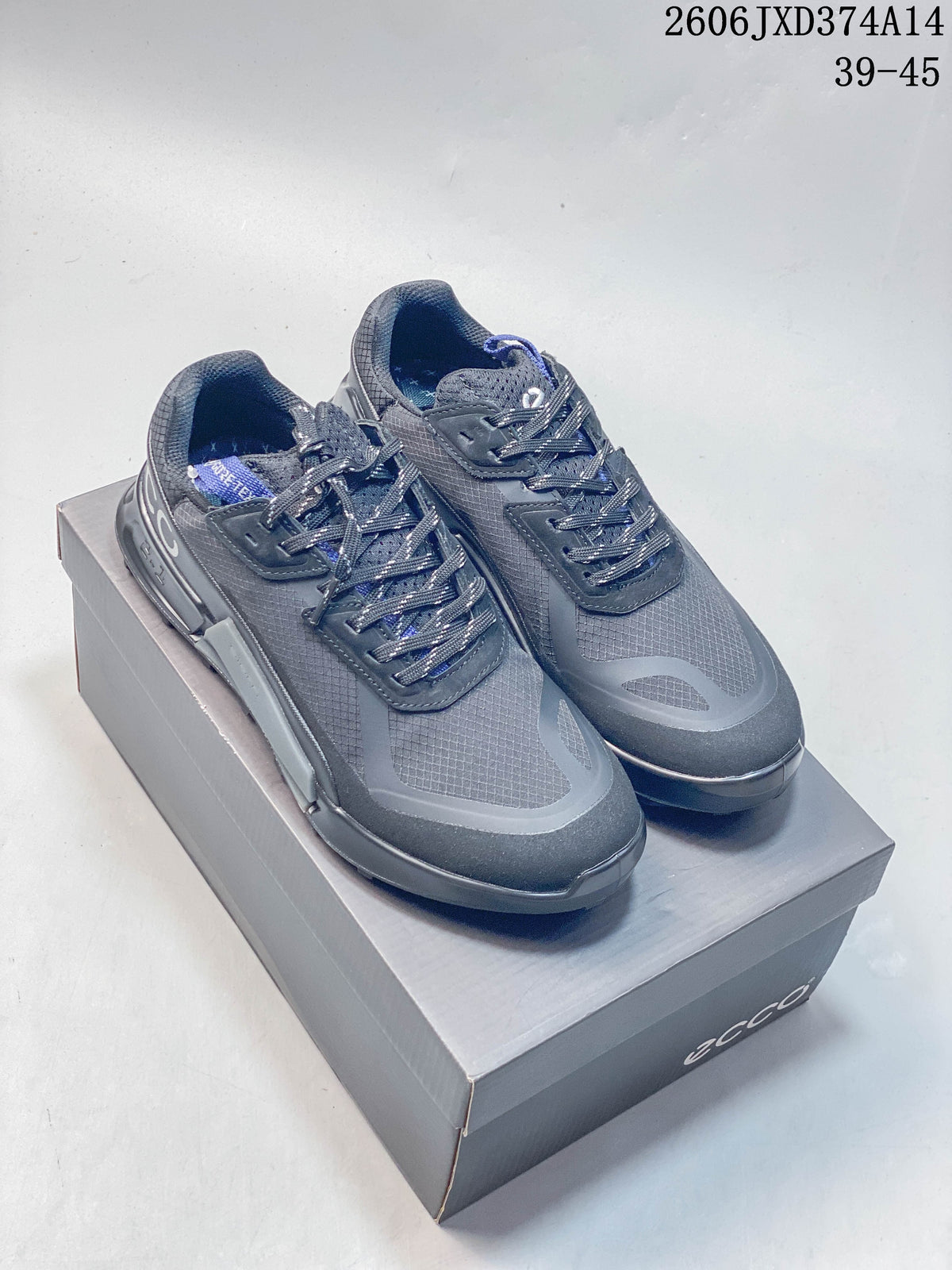 Pair of gray ECCO sneakers with laces and textured panels on a box