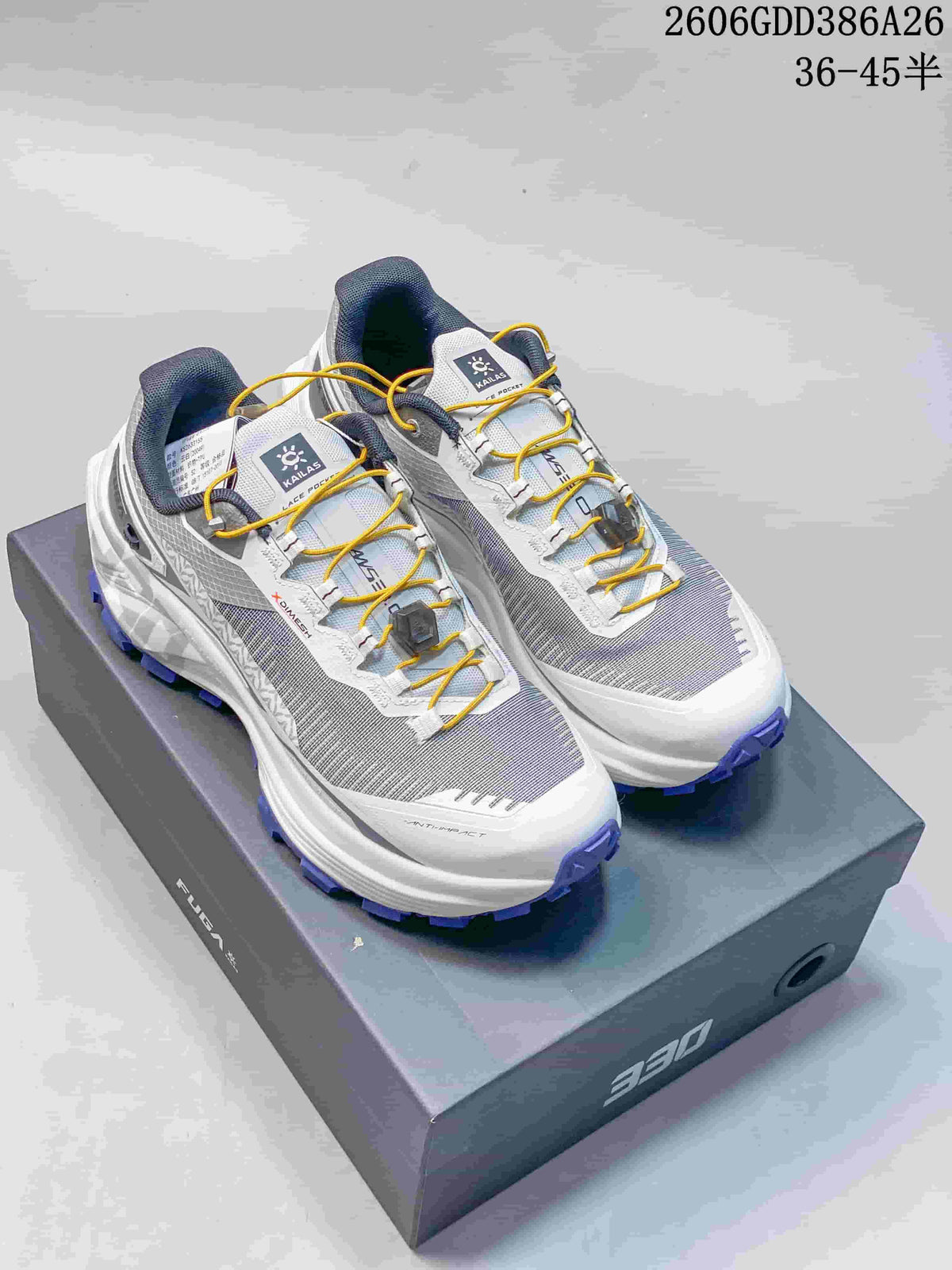 White and gray KAILAS FUGA EX330 trail shoes with yellow laces and purple outsole lugs