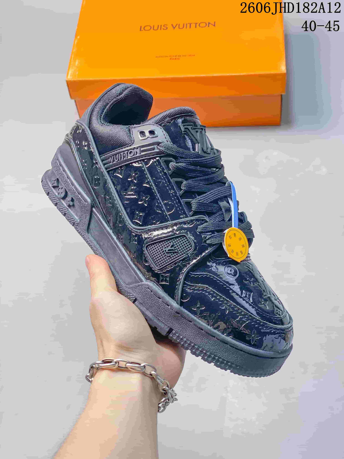 Angled side view of a dark navy Louis Vuitton Trainer sneaker