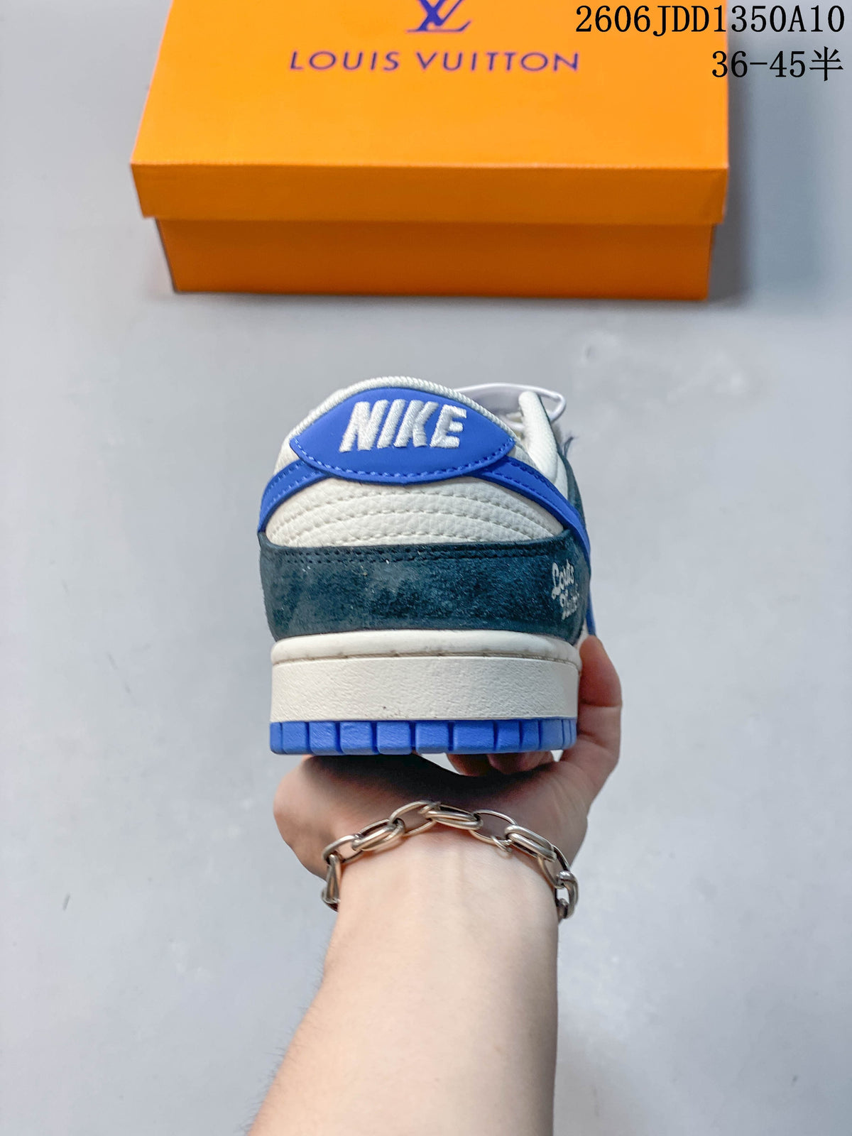 Rear view of a white, teal and blue low-top sneaker