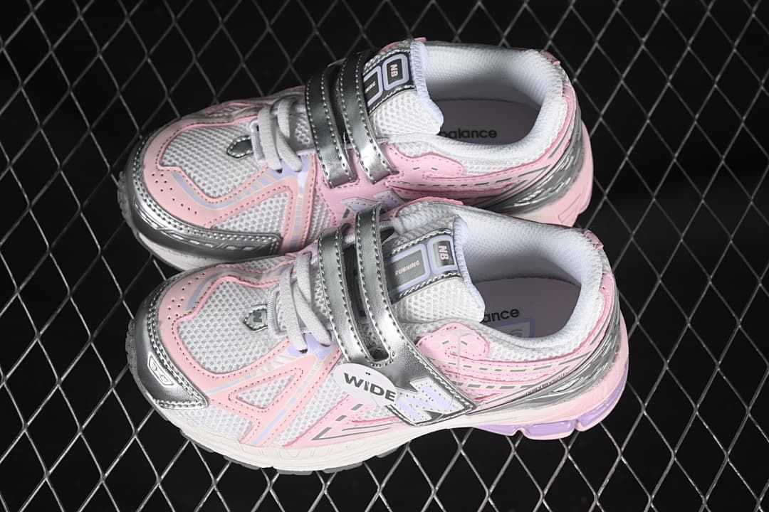 Pair of pink, silver, and white kids’ sneakers shown from above.