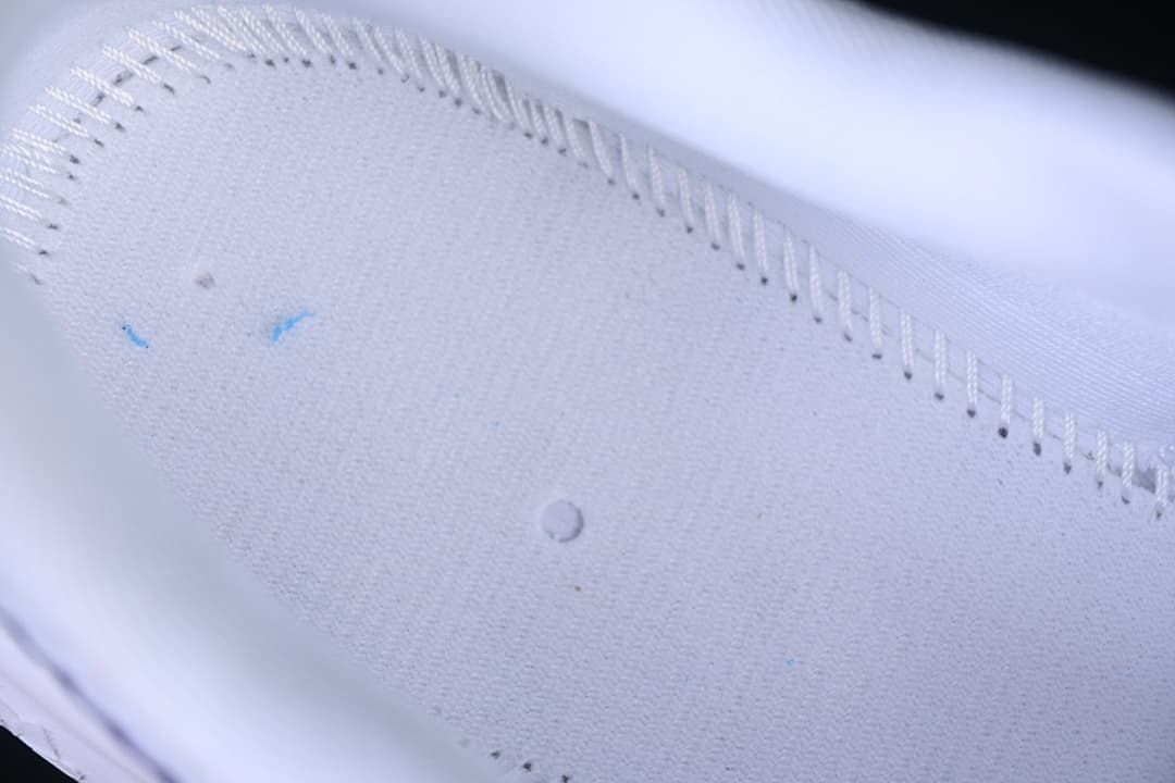 Close-up of the stitched white upper